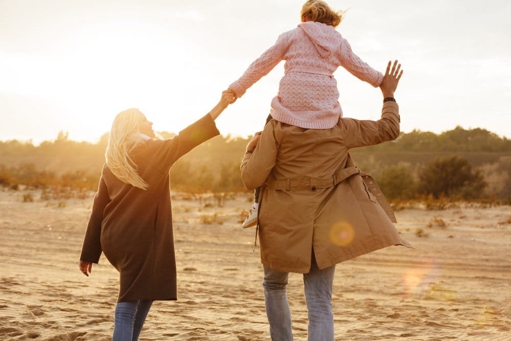 portrait joyful family with daughter spending time
